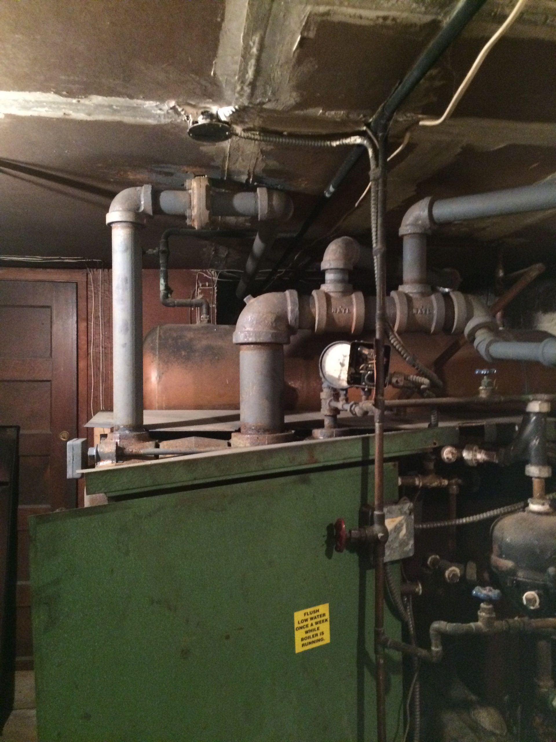 Able Air technician repairing a boiler in Massapequa Park, NY